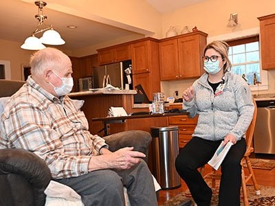 Patient Terry McCabe visits with Dr. Carlen Smith of Maine Dartmouth Geriatric Medicine.