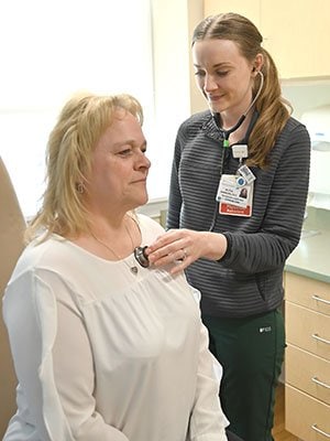 A MaineGeneral Express Care clinician treats a patient