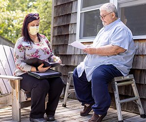 MaineGeneral IMPaCT Community Health Worker Katie Rugg, left, and patient John Carey