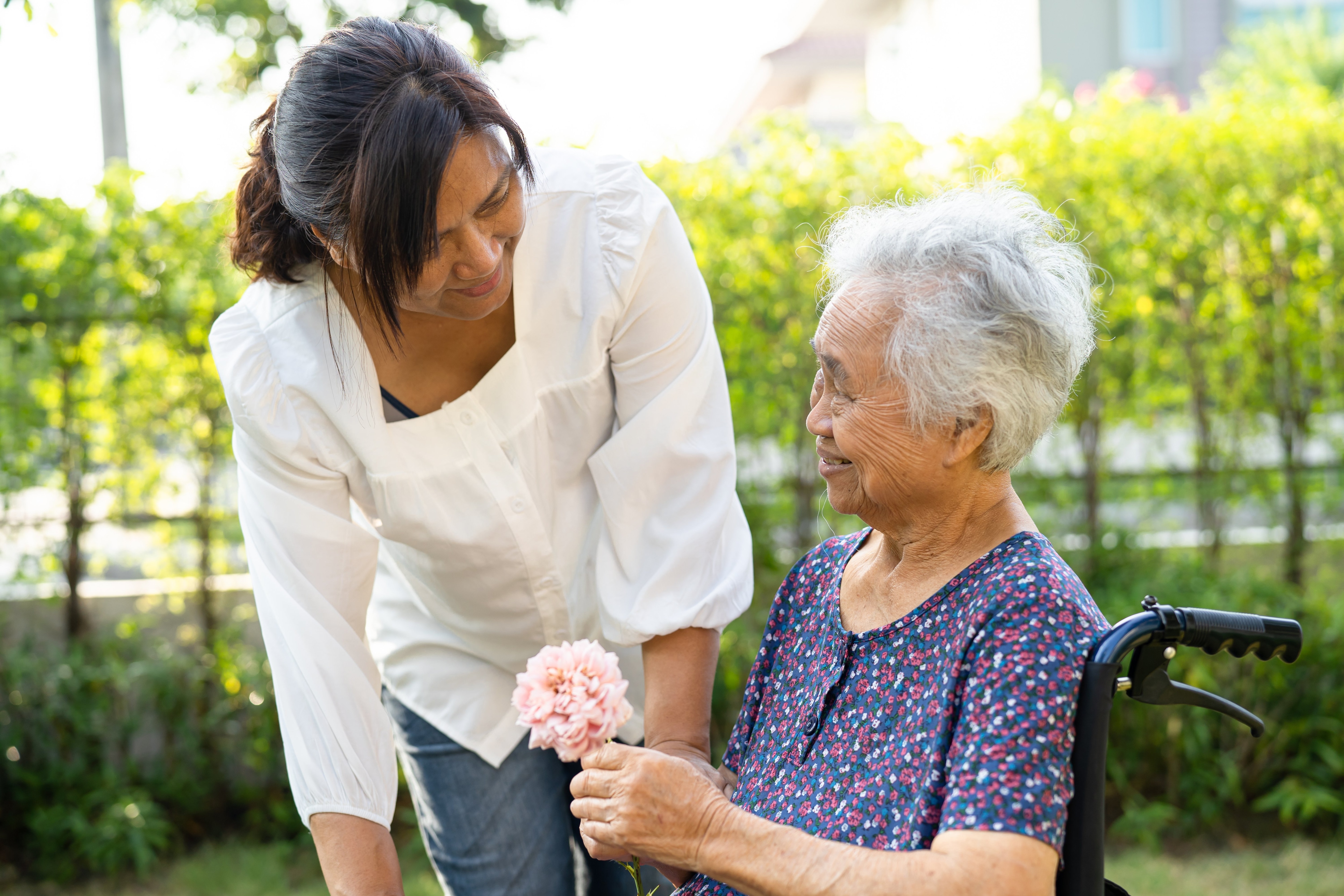 woman cares for elderly mother